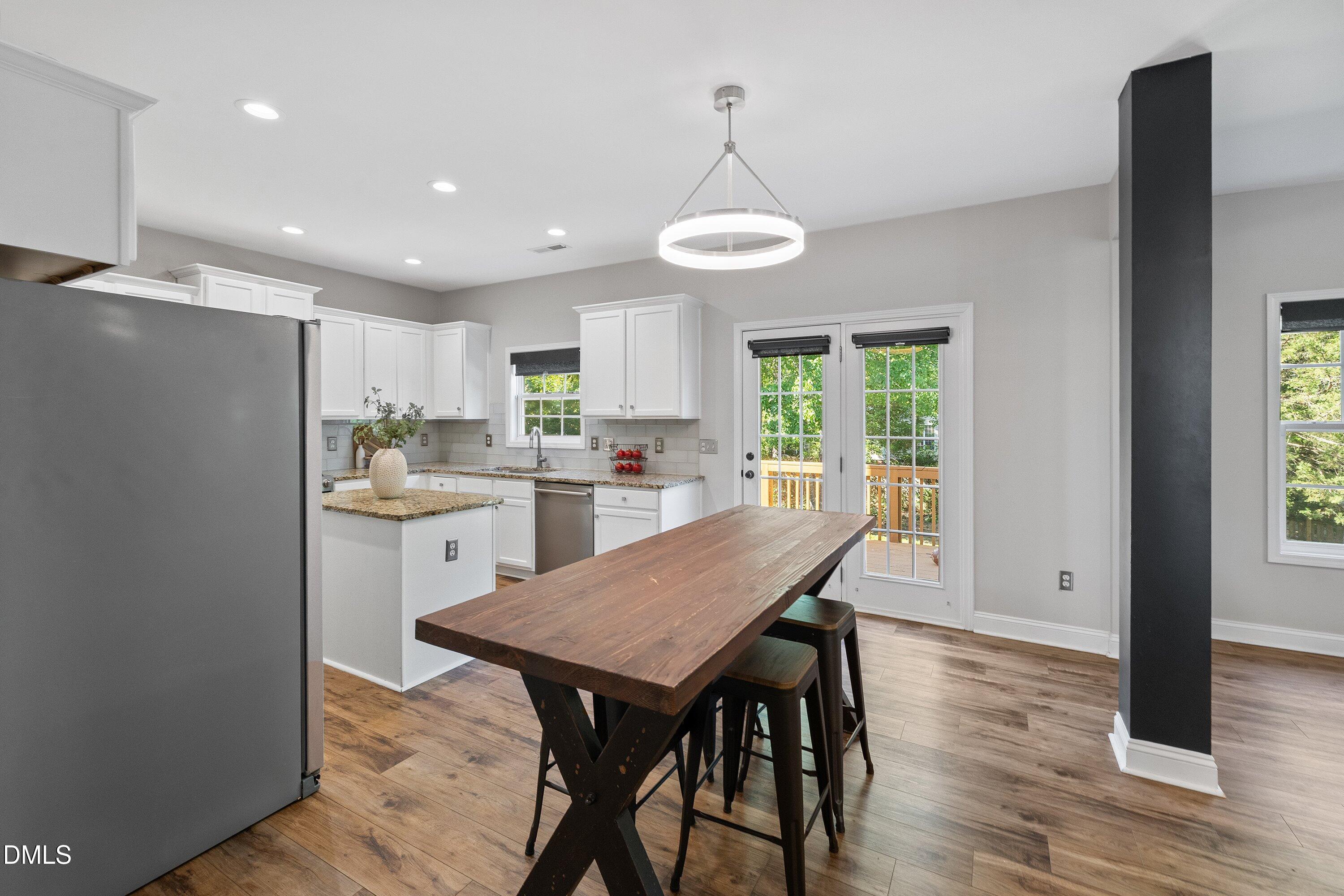 3717 Windmeade Road Wake Forest, NC 27587 - Photo 20 of 51 a kitchen with a table and chairs in it