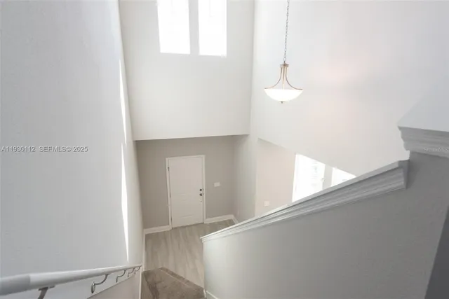 a view of an empty room and window