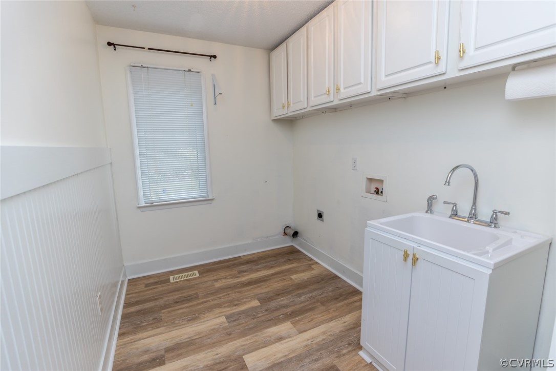14009 Harbour Pointe Road Midlothian, VA 23112 - Photo 18 of 50 1rst floor laundry room with laminate flooring, wa