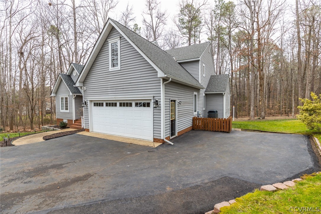 14009 Harbour Pointe Road Midlothian, VA 23112 - Photo 39 of 50 Right side "West facing" of home showing fenced tr