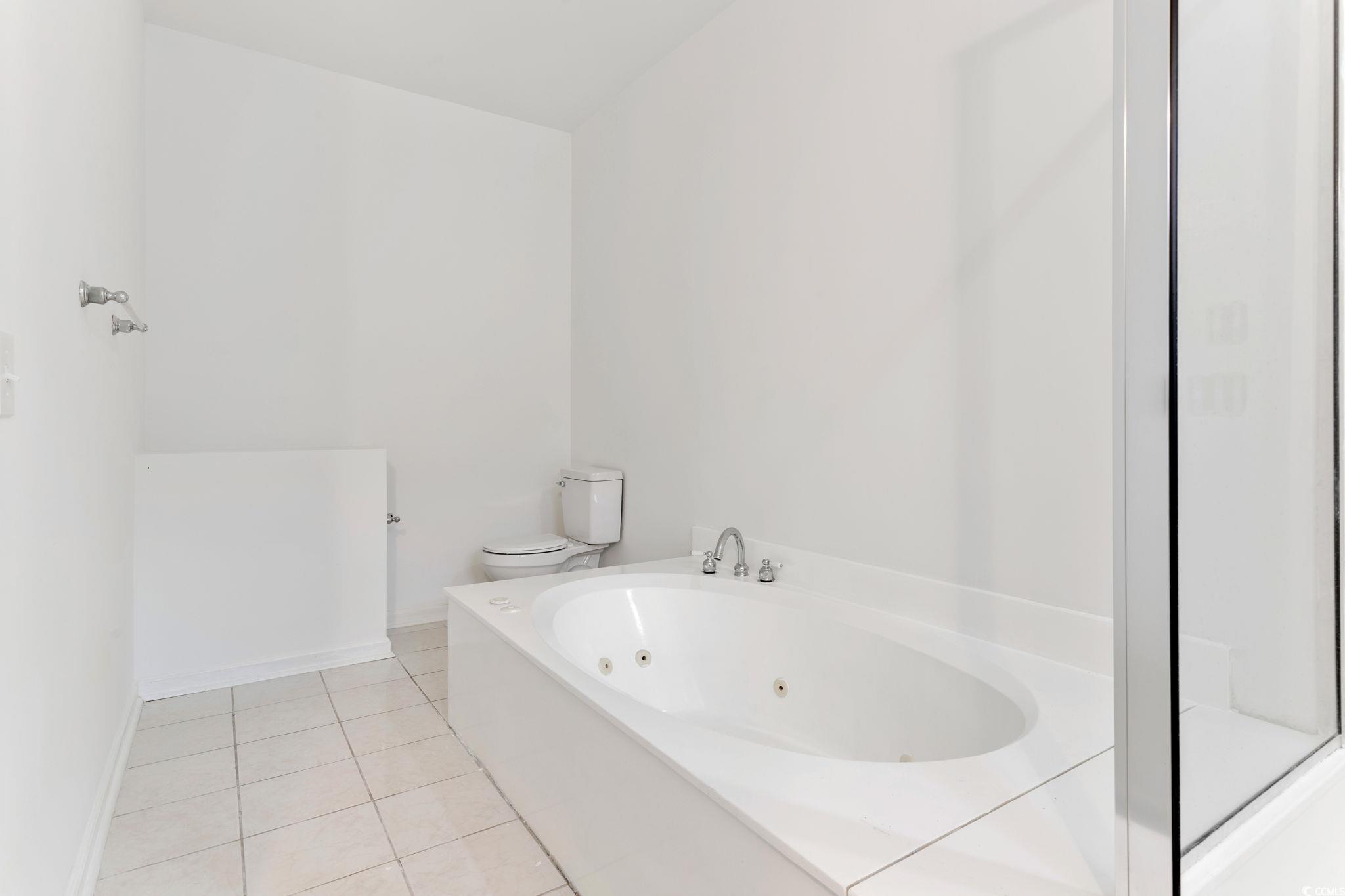 2321 Brick Drive Longs, SC 29568 - Photo 24 of 40 Bathroom featuring a whirlpool tub and light tile patterned floors