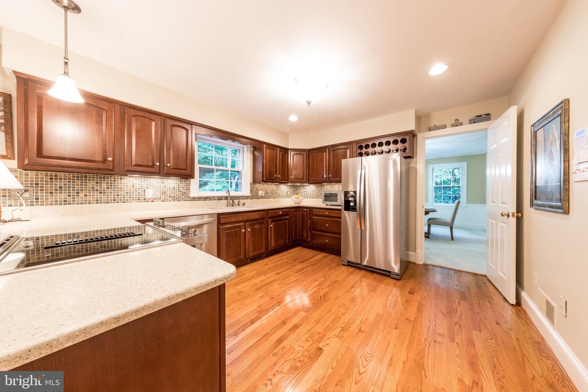 6040 Chapman Road Lorton, VA 22079 - Photo 20 of 58 Notice the custom wine rack above the fridge!