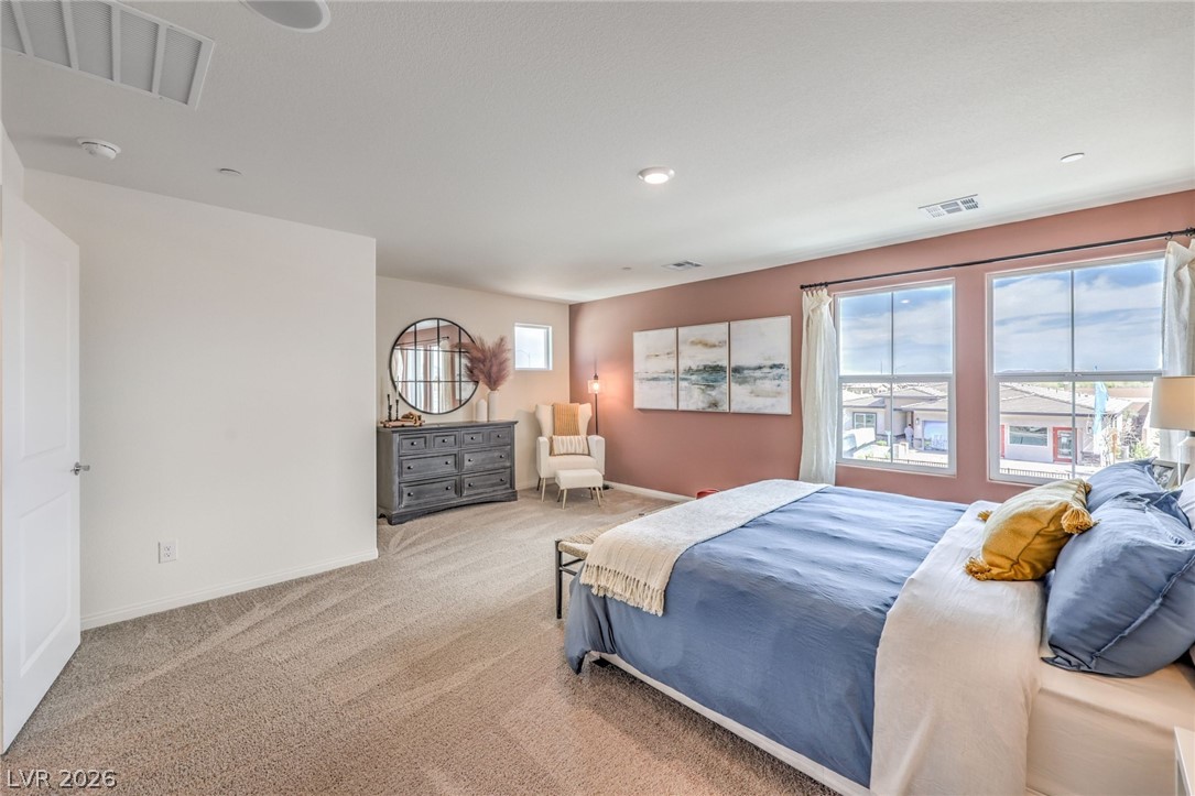 1017 Copper Robin Street Henderson, NV 89011 - Photo 21 of 43 Bedroom featuring carpet floors and baseboards. Photo is representational only; actual home finishes may vary.