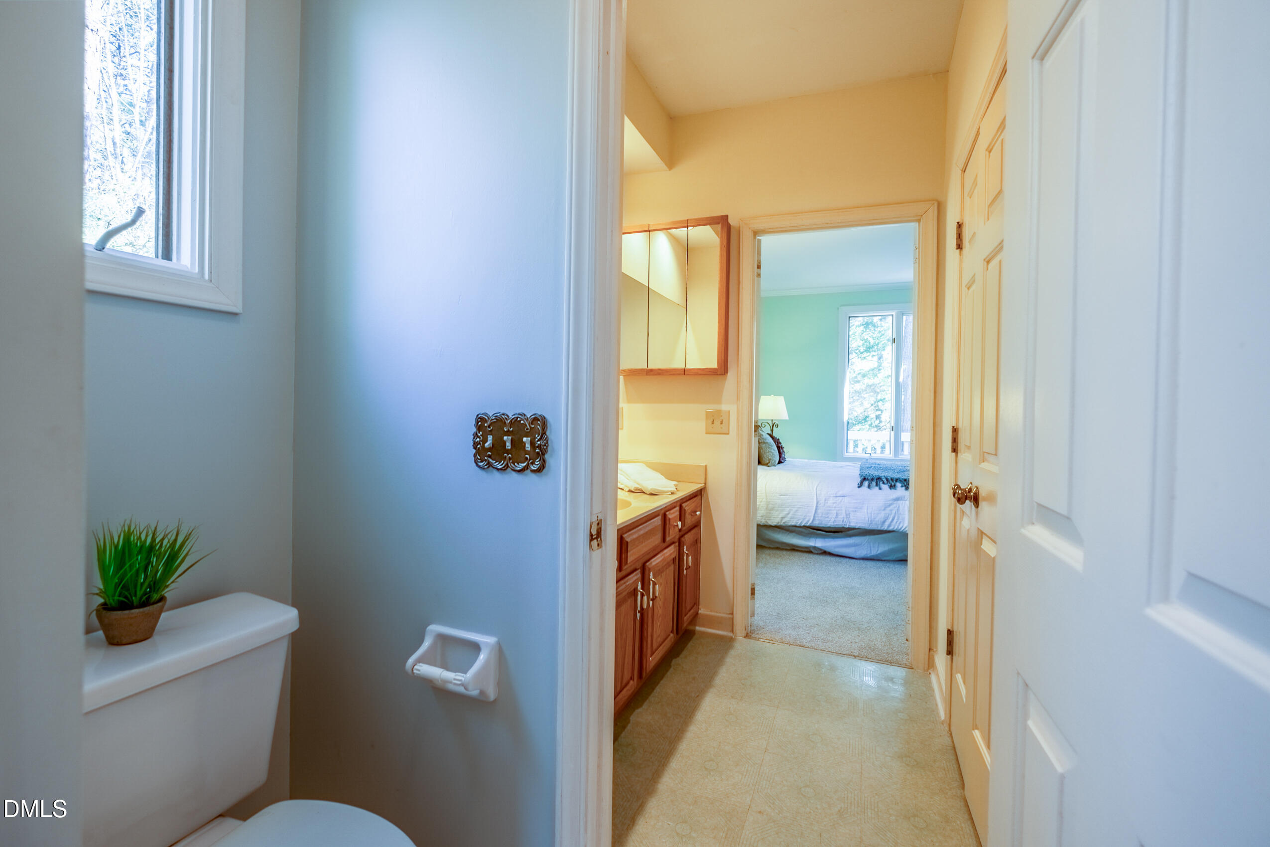 10 Innisfree Drive Durham, NC 27707 - Photo 25 of 36 a en suite bathroom with a toilet a sink and a window