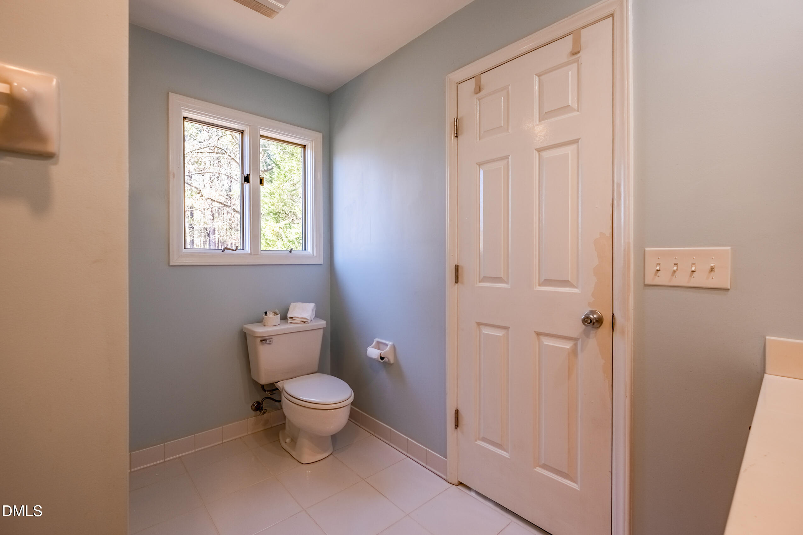 10 Innisfree Drive Durham, NC 27707 - Photo 31 of 36 a bathroom with a toilet and a window