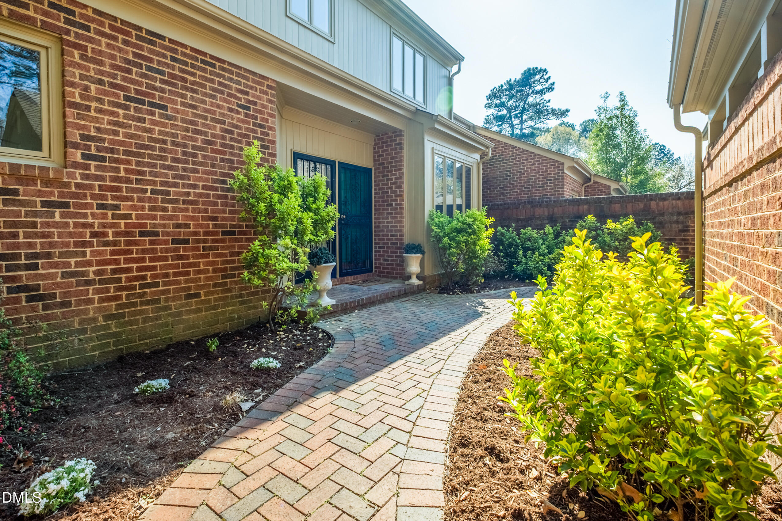 10 Innisfree Drive Durham, NC 27707 - Photo 4 of 36 a view of yellow house with flower plants