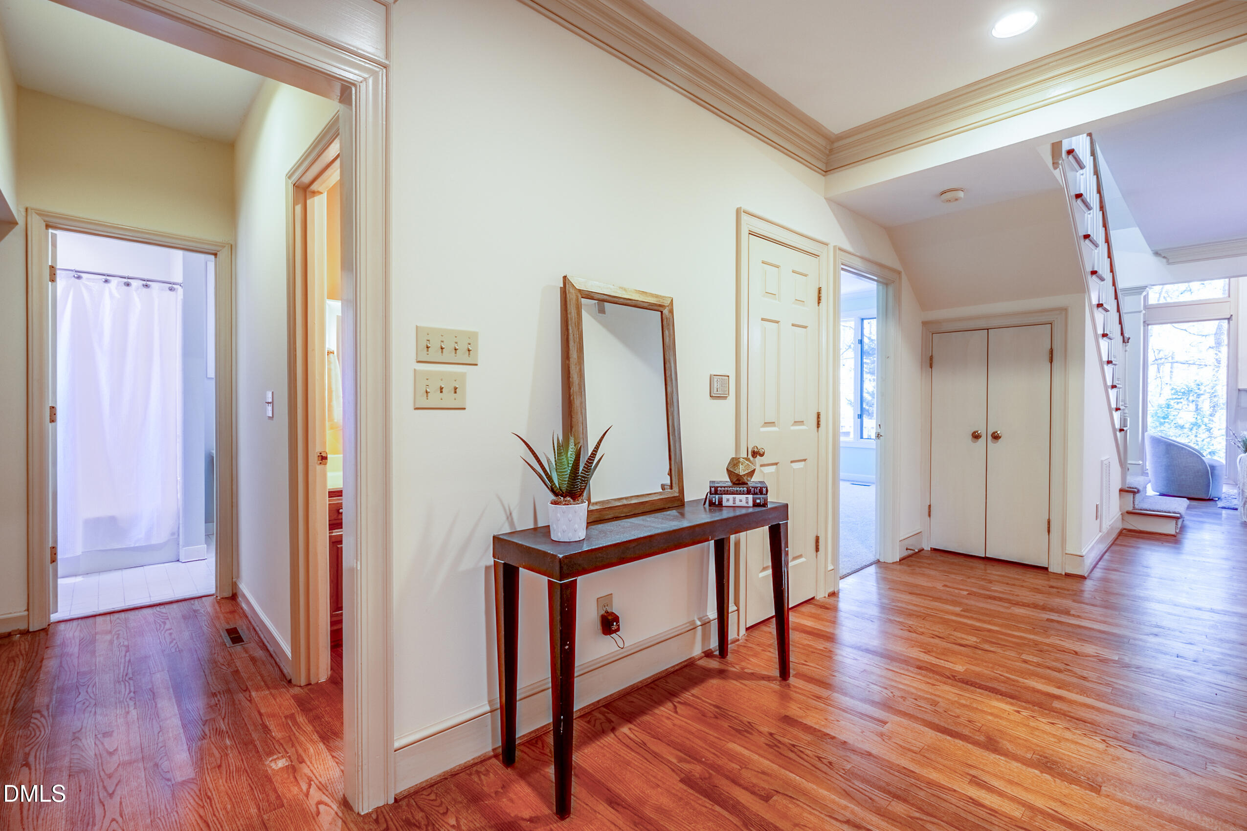 10 Innisfree Drive Durham, NC 27707 - Photo 9 of 36 a view of a hallway with wooden floor and furniture