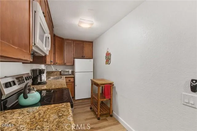 a room with furniture a rug and a window