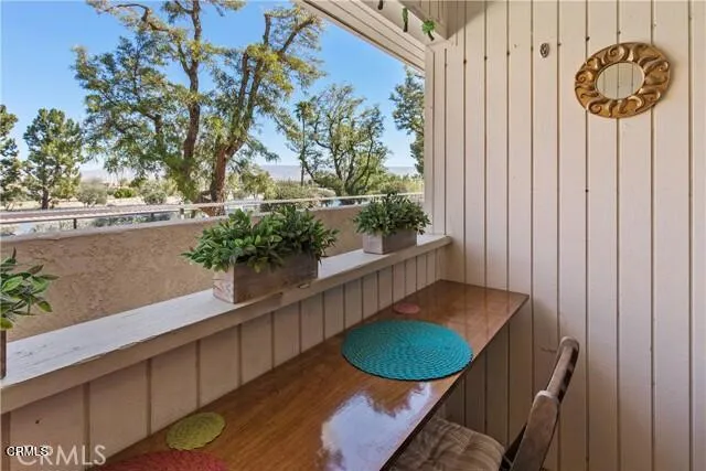 a view of a balcony with chairs