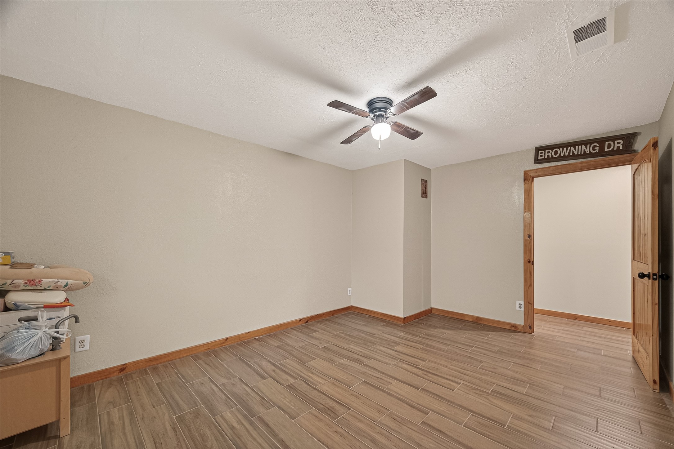 588 County Road 2307 Cleveland, TX 77327 - Photo 12 of 24 a view of a big room with wooden floor and closet area