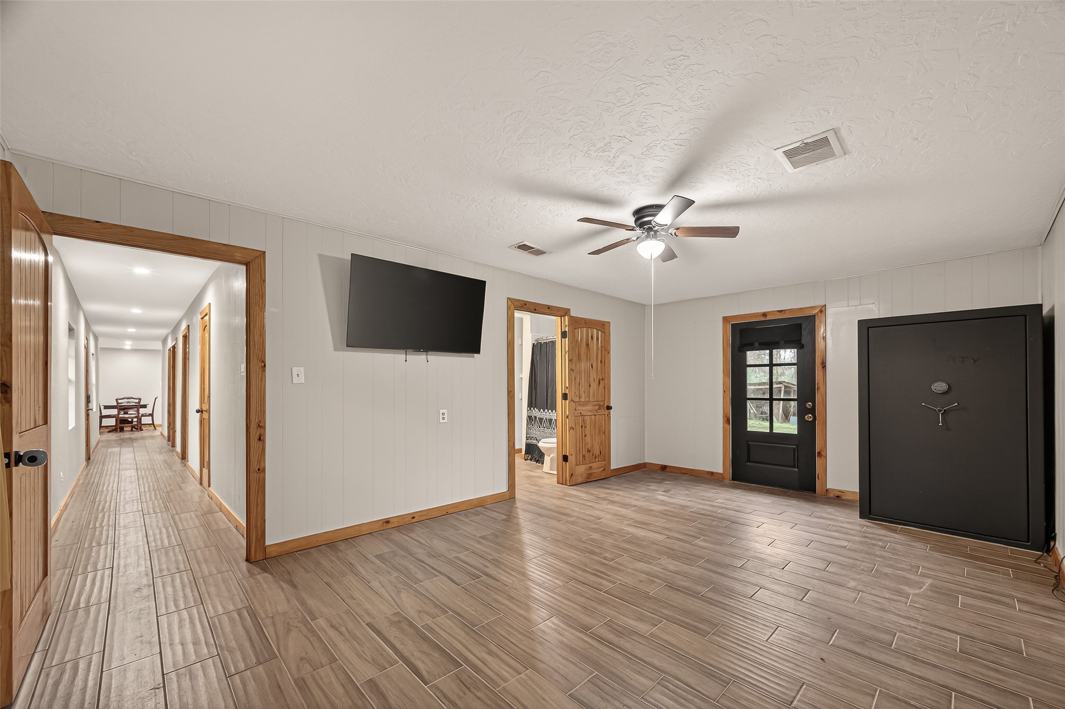 588 County Road 2307 Cleveland, TX 77327 - Photo 15 of 24 a view of a livingroom with wooden floor