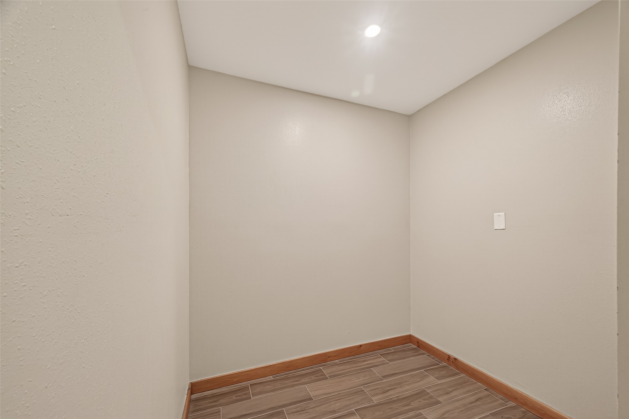 588 County Road 2307 Cleveland, TX 77327 - Photo 18 of 24 a view of small space with wooden floor