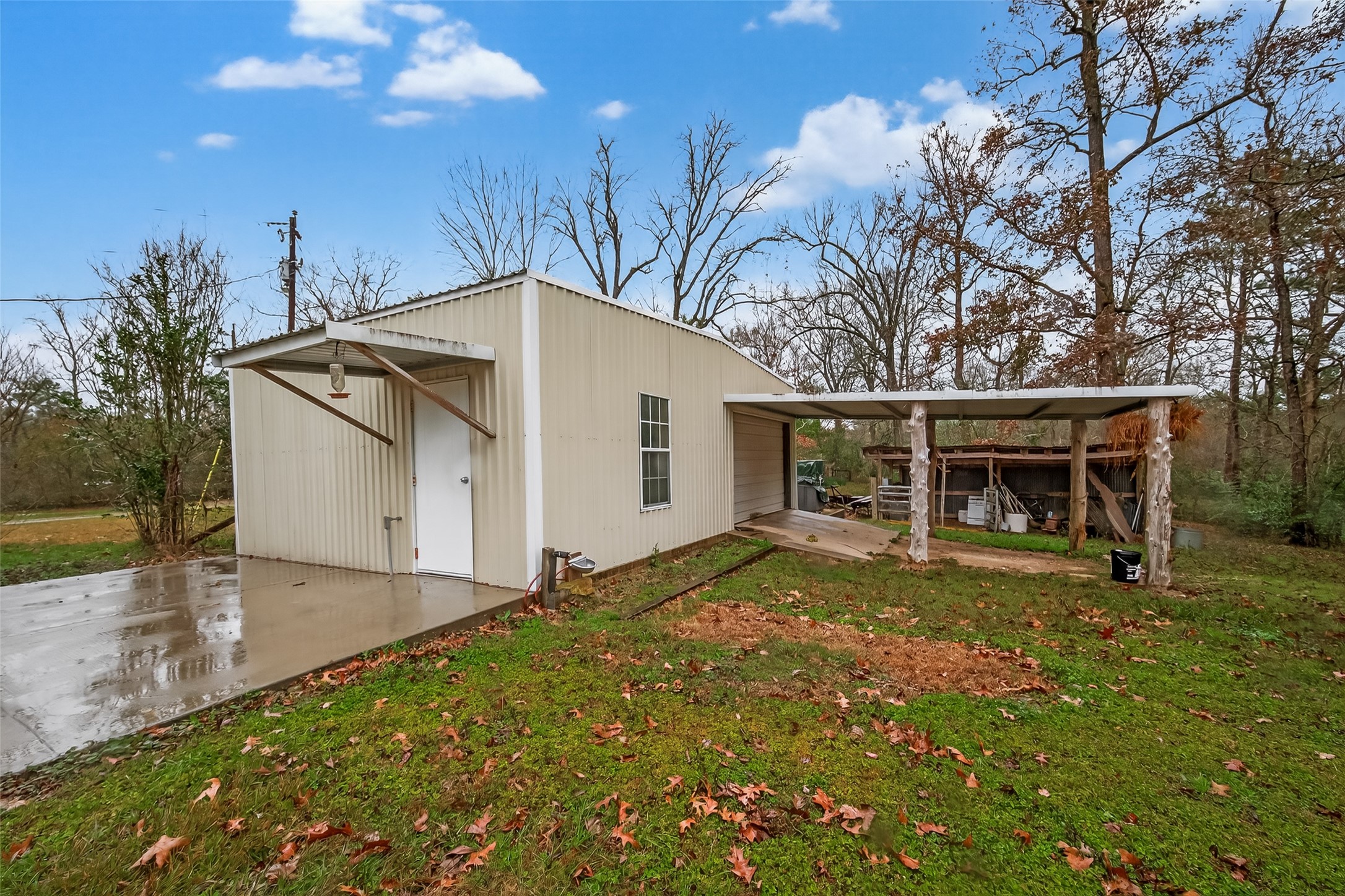 588 County Road 2307 Cleveland, TX 77327 - Photo 23 of 24 a view of house with outdoor space and sitting area