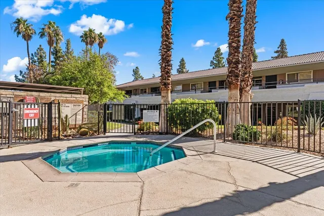 a view of a swimming pool with a yard