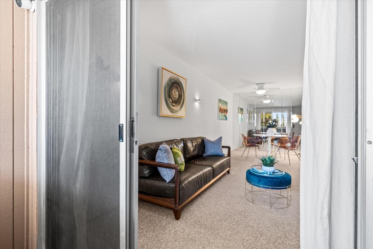 2860 North Los Felices Road, Unit 214 Palm Springs, CA 92262 - Photo 7 of 24 a living room with furniture and a table