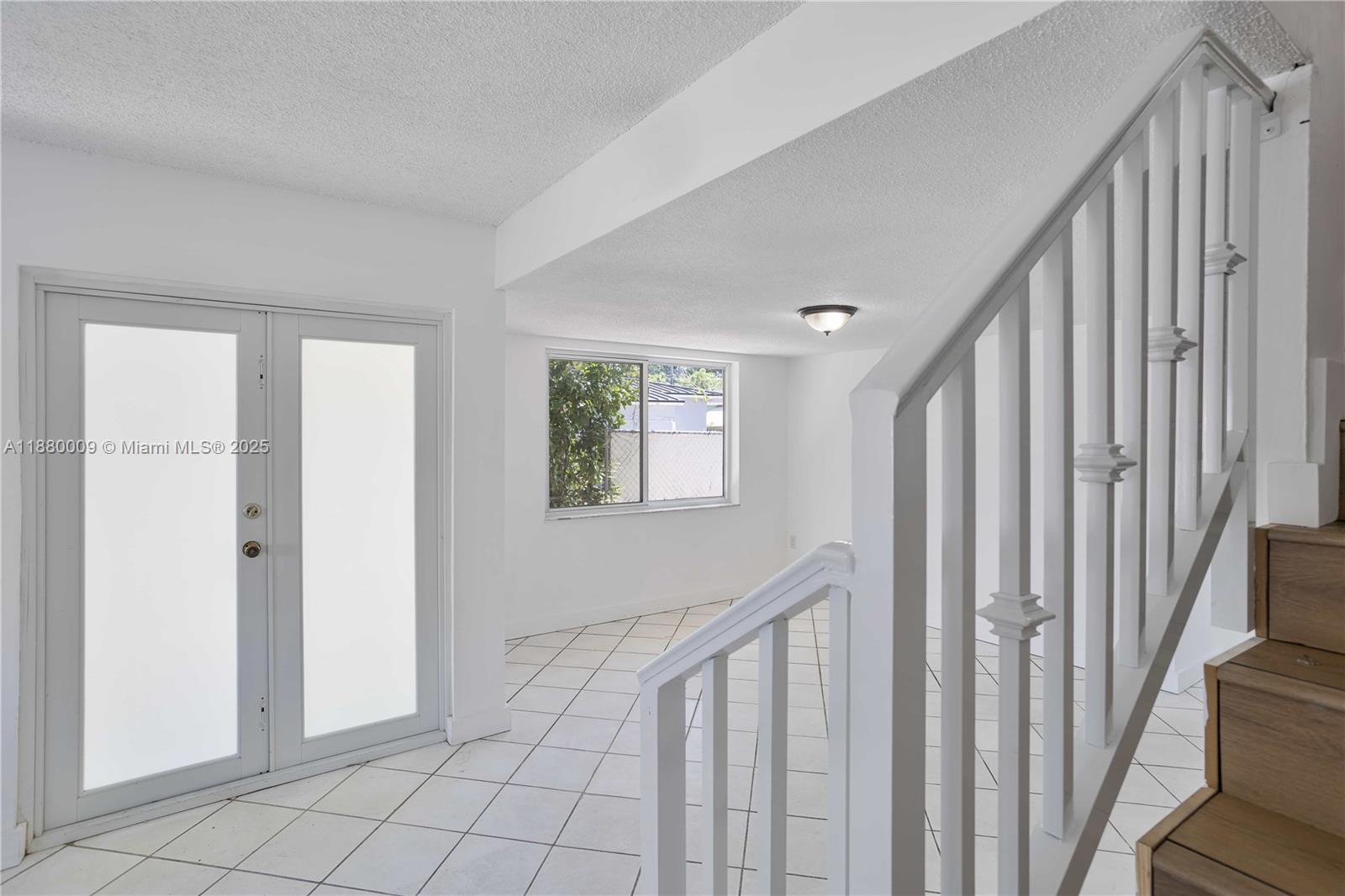 3524 Northwest 4th Terrace, Unit 1 Miami, FL 33125 - Photo 11 of 35 a view of a hallway with windows