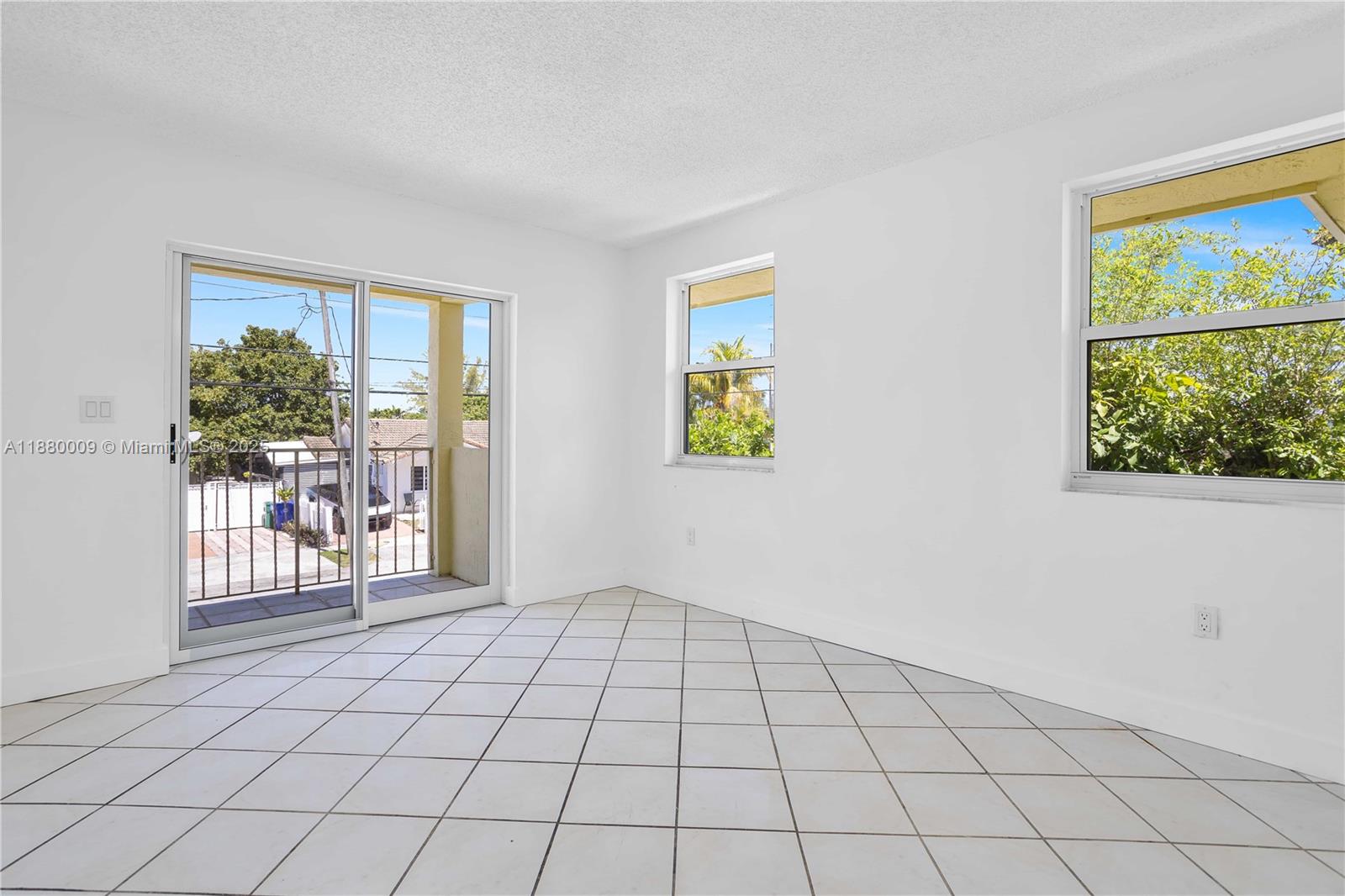 3524 Northwest 4th Terrace, Unit 1 Miami, FL 33125 - Photo 12 of 35 a view of an empty room and window