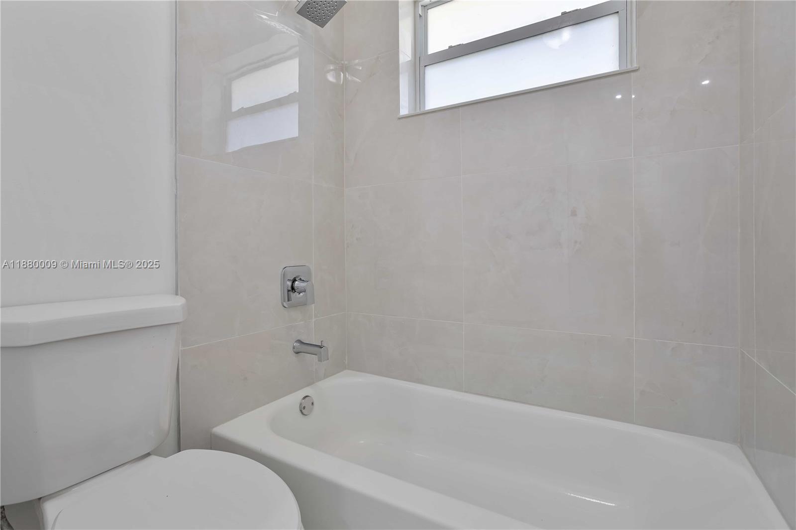 3524 Northwest 4th Terrace, Unit 1 Miami, FL 33125 - Photo 20 of 35 a bathroom with a toilet and bathtub