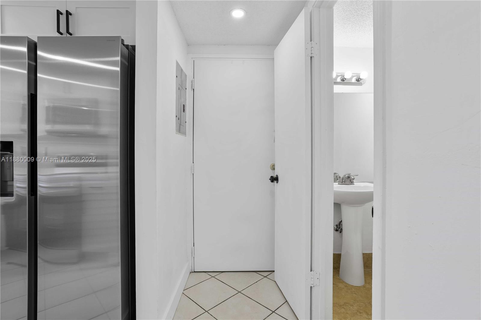 3524 Northwest 4th Terrace, Unit 1 Miami, FL 33125 - Photo 9 of 35 a bathroom with a glass shower door