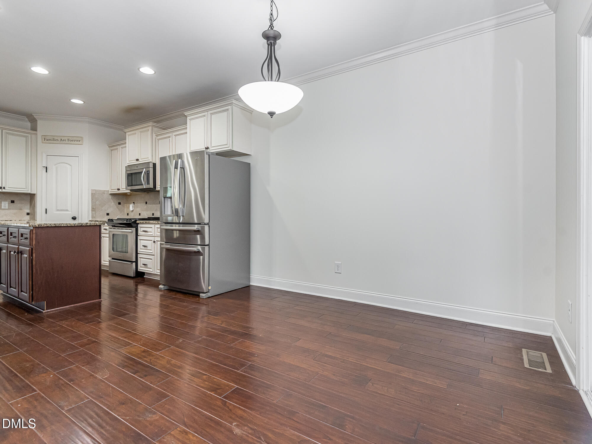 337 Shadowdale Lane Rolesville, NC 27571 - Photo 16 of 42 a kitchen with stainless steel appliances a refrigerator and a stove top oven