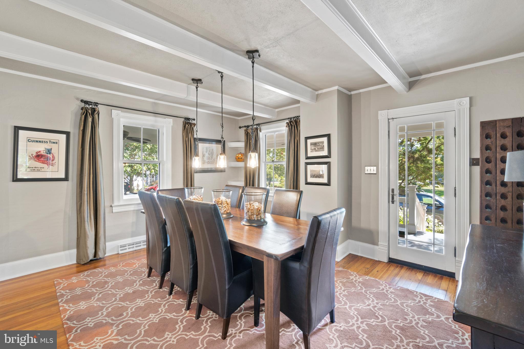1005 Grant Street Herndon, VA 20170 - Photo 14 of 59 a dining room with furniture a chandelier and wooden floor