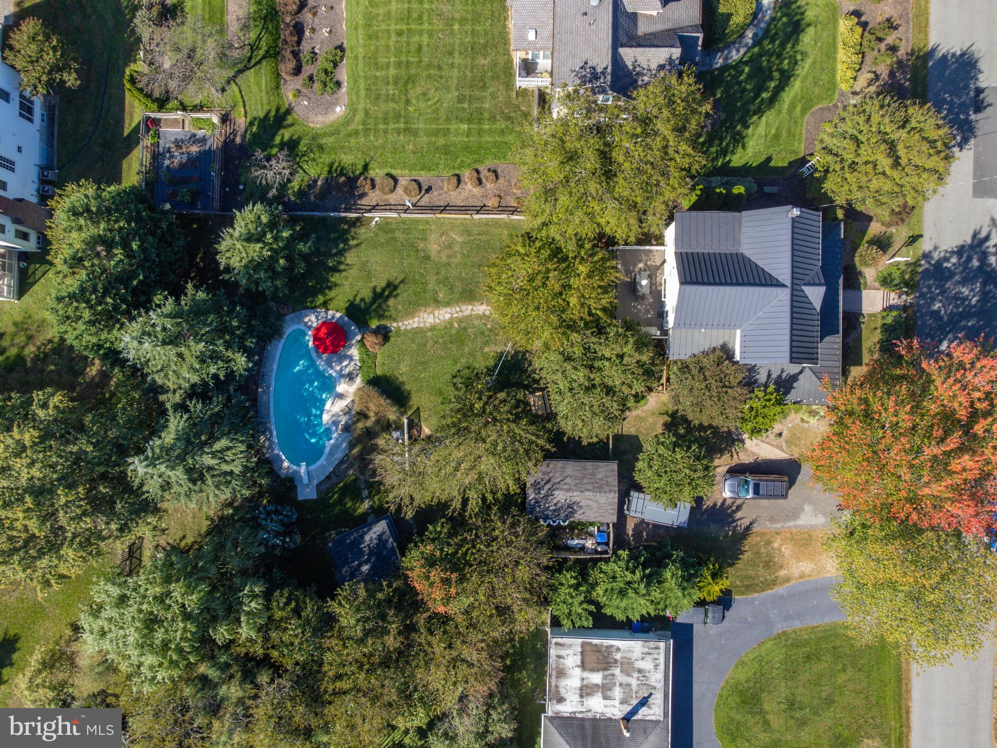 1005 Grant Street Herndon, VA 20170 - Photo 2 of 59 an aerial view of a house with a yard and garden