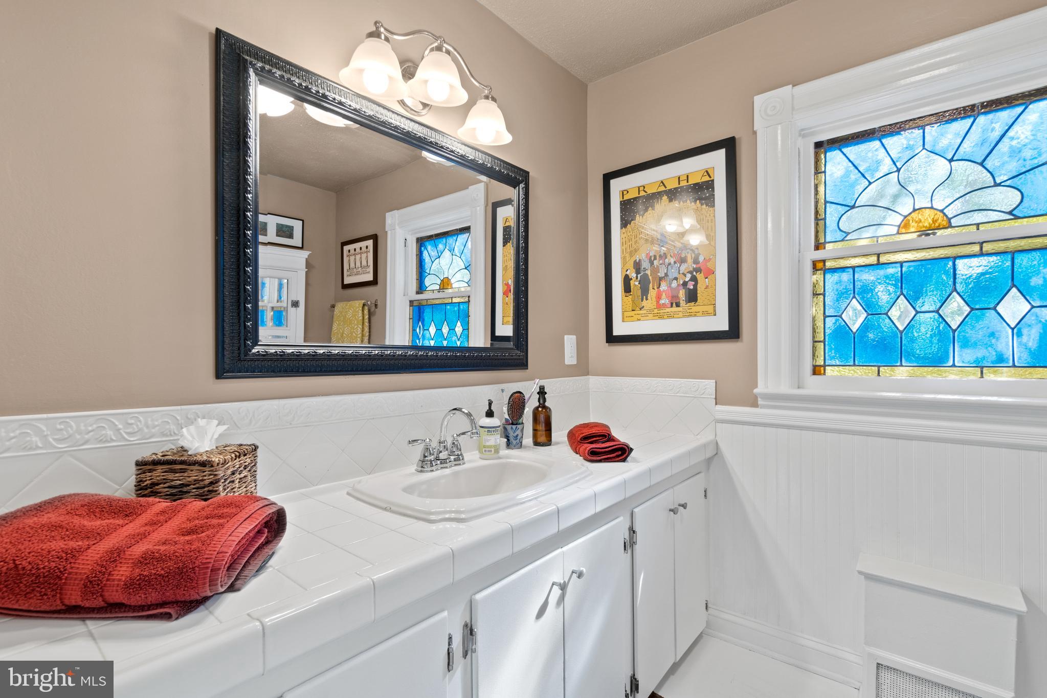 1005 Grant Street Herndon, VA 20170 - Photo 23 of 59 a bathroom with a sink and a mirror