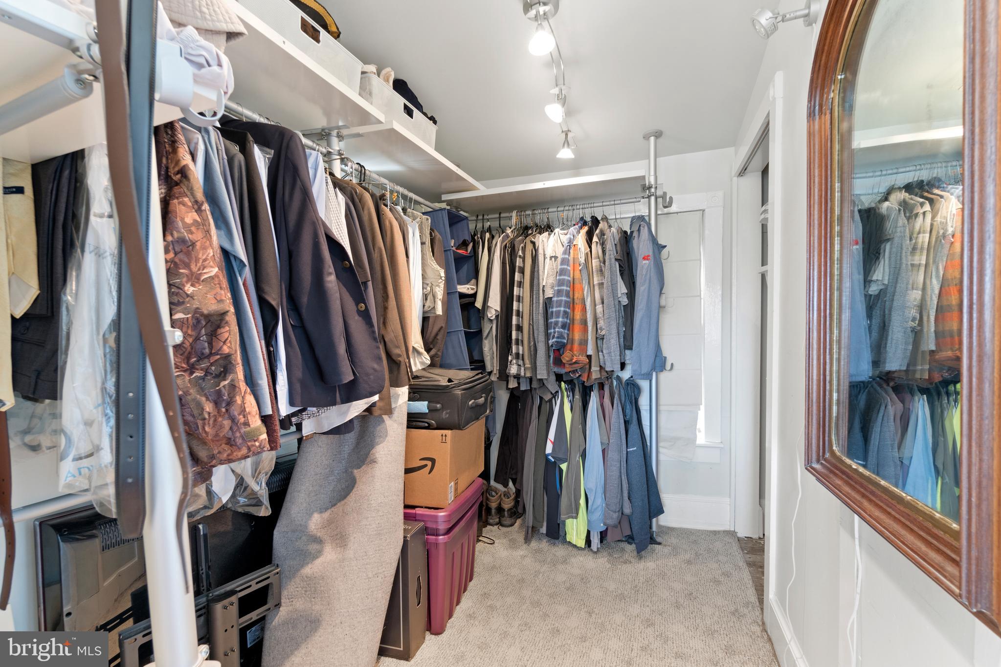 1005 Grant Street Herndon, VA 20170 - Photo 28 of 59 a view of walk in closet with clothes and shoes