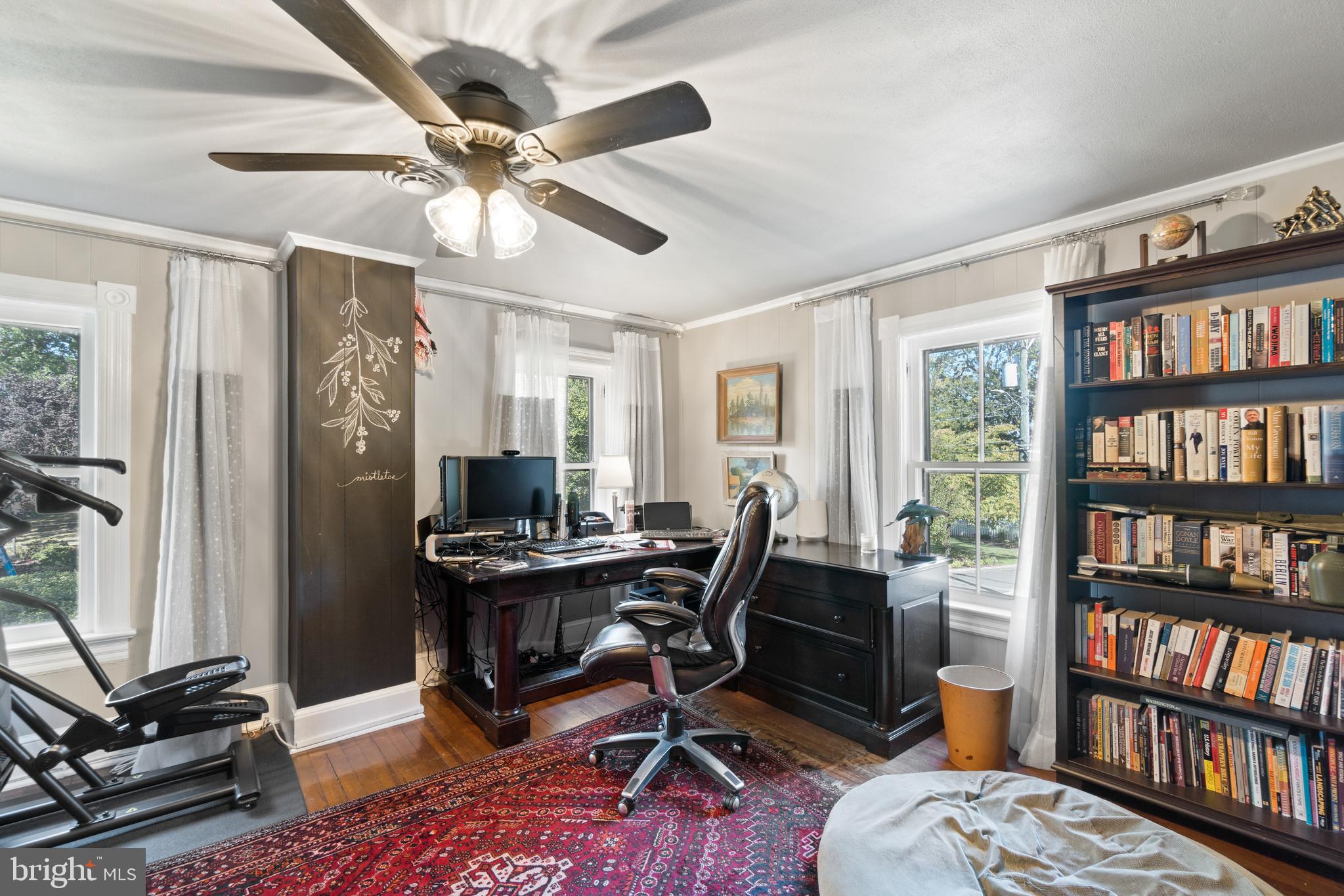 1005 Grant Street Herndon, VA 20170 - Photo 30 of 59 a workspace with a bookshelf and a window