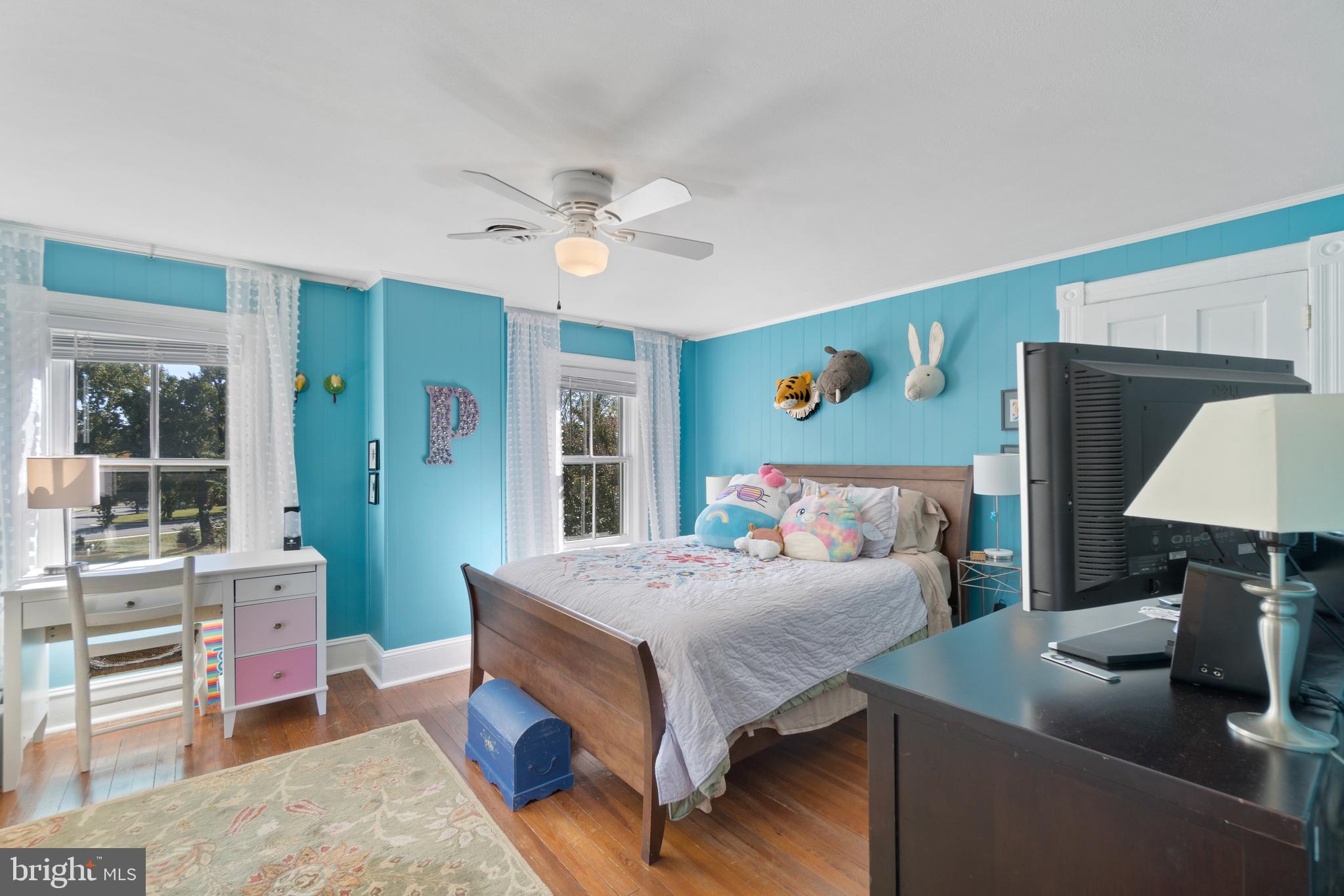 1005 Grant Street Herndon, VA 20170 - Photo 32 of 59 a bedroom with a bed wooden floor and window