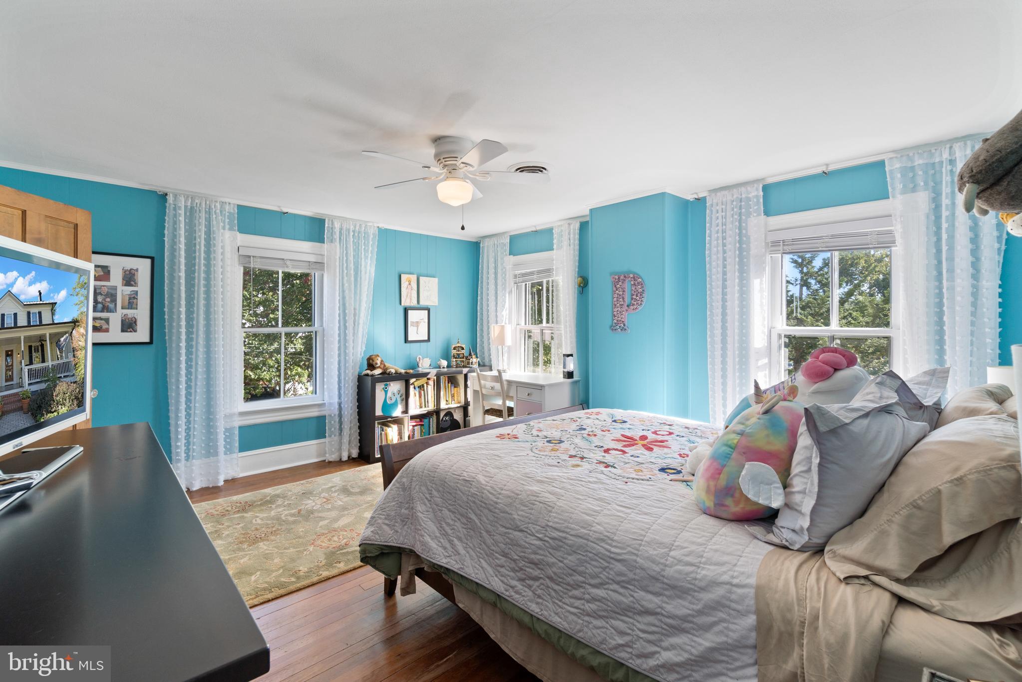 1005 Grant Street Herndon, VA 20170 - Photo 33 of 59 a bedroom with a bed and wooden floor