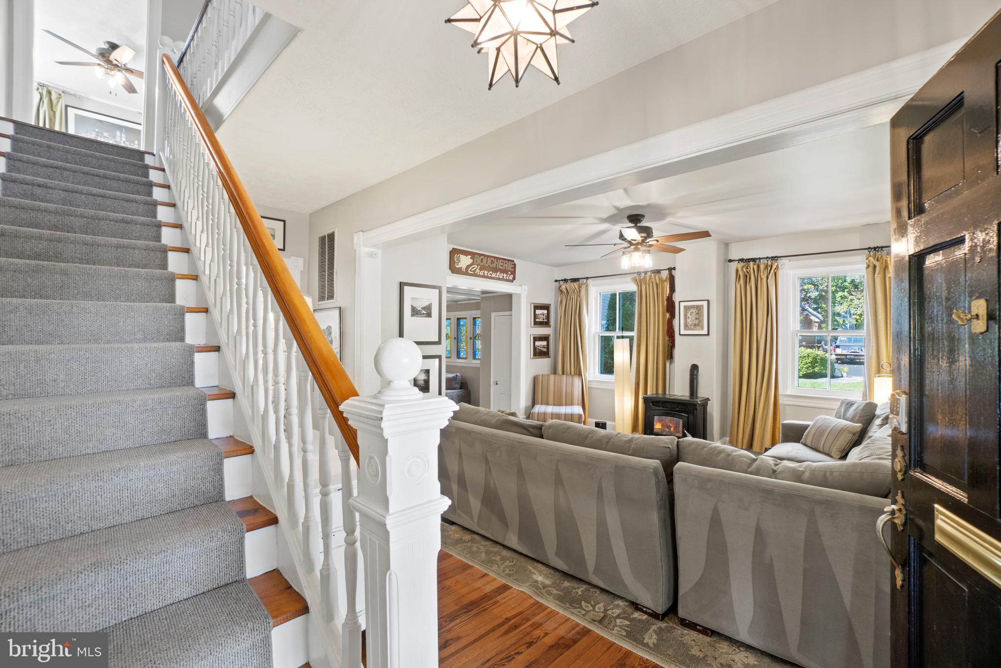 1005 Grant Street Herndon, VA 20170 - Photo 7 of 59 a living room with furniture and a chandelier