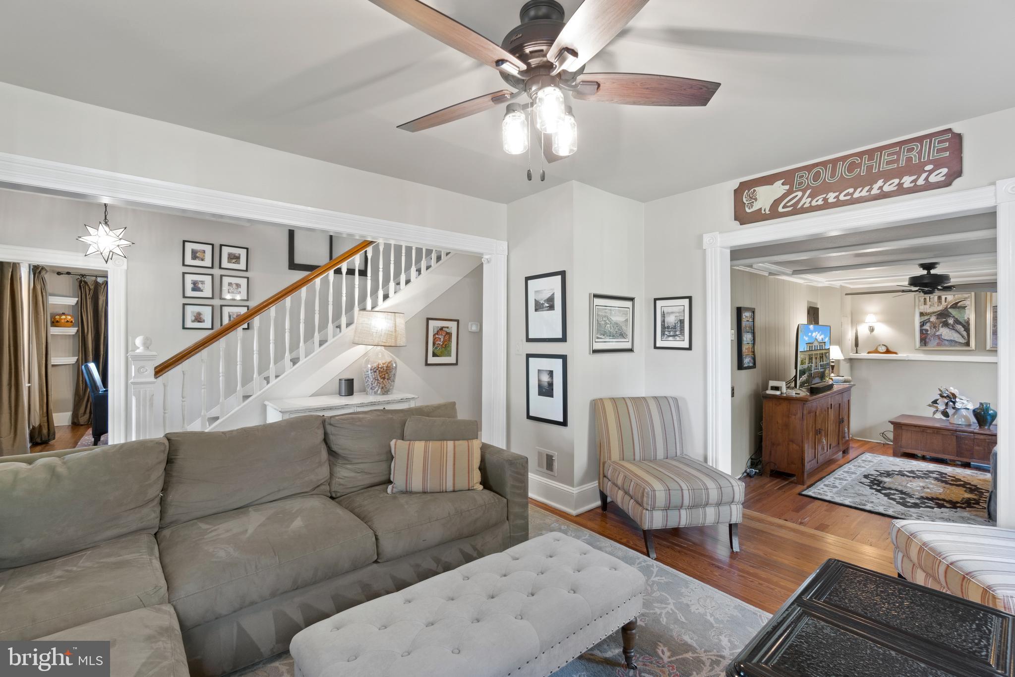 1005 Grant Street Herndon, VA 20170 - Photo 9 of 59 a living room with furniture and a chandelier