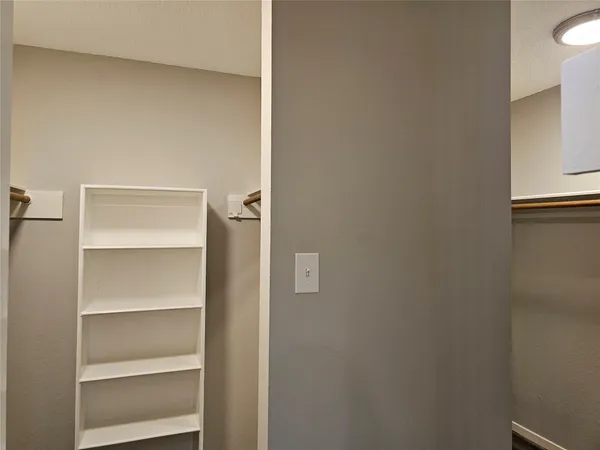a view of an empty walk in closet