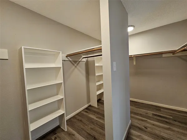 a view of closet area with empty racks