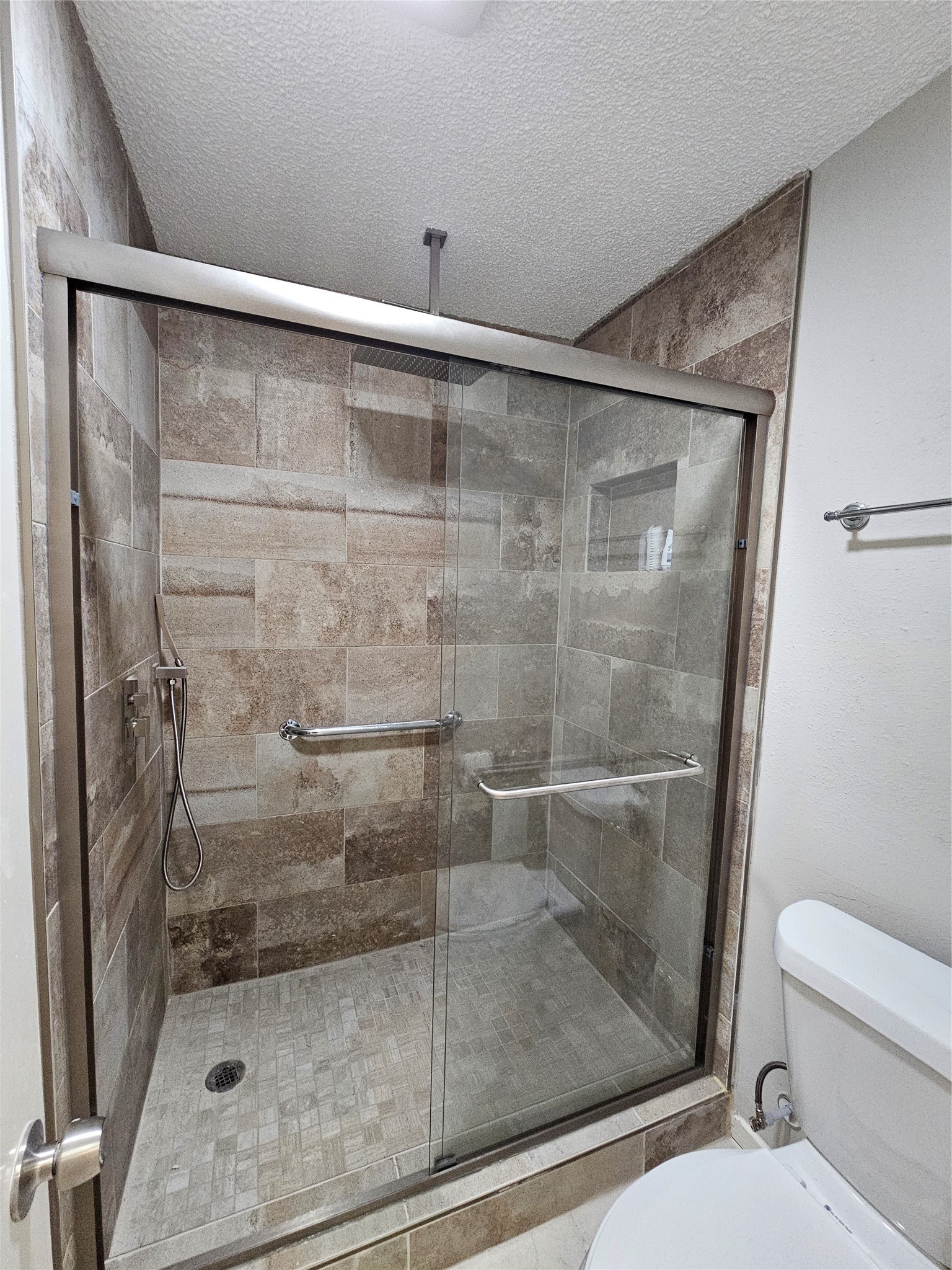 7887 Kendalia Drive Houston, TX 77036 - Photo 18 of 23 a bathroom with a shower