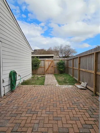 a view of a backyard with sitting area