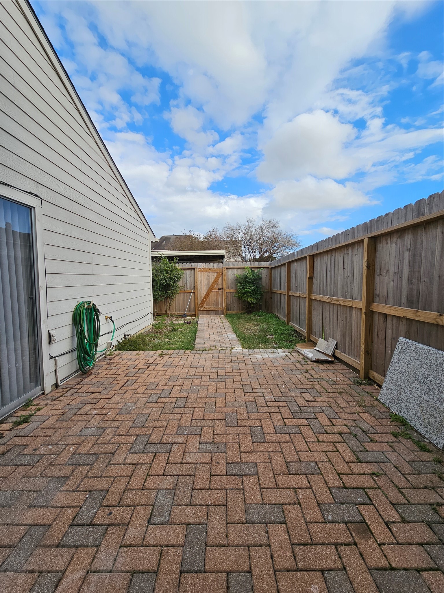 7887 Kendalia Drive Houston, TX 77036 - Photo 10 of 23 a view of a backyard with sitting area
