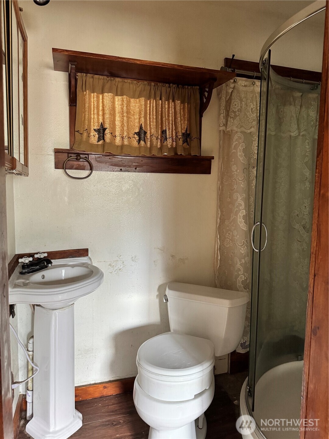 13 Rope And Saddle Lane Tonasket, WA 98855 - Photo 9 of 28 a bathroom with a toilet sink and shower