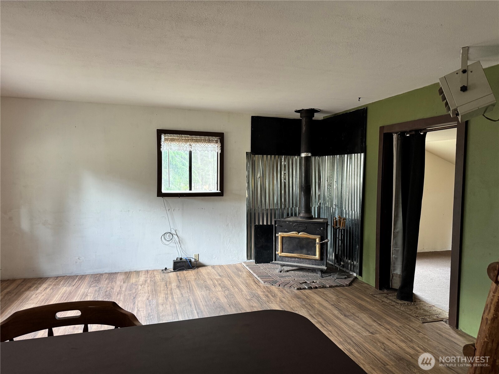13 Rope And Saddle Lane Tonasket, WA 98855 - Photo 10 of 28 a bedroom with a bed and a television