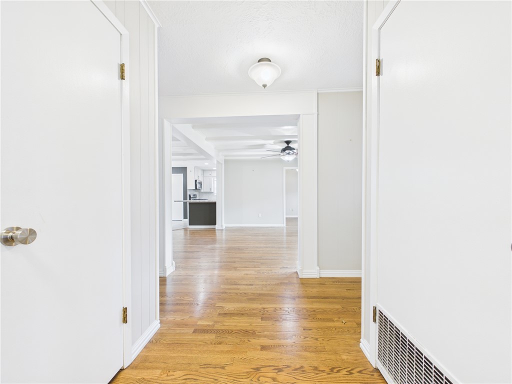 902 Briar Bend Court Bryan, TX 77802 - Photo 21 of 39 a view of a hallway with wooden floor