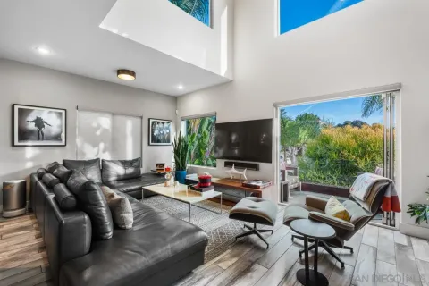 a living room with furniture or couch and a wooden floor