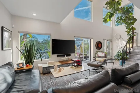 a kitchen with stainless steel appliances a stove refrigerator sink and microwave