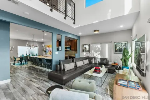a kitchen with stainless steel appliances a sink stove and cabinets