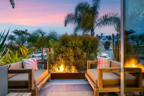 a view of a lake with couches and city view