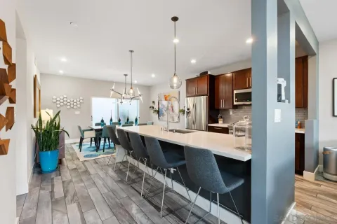 a view of a dining room with furniture window and wooden floor