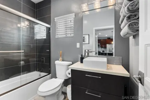 a en suite bathroom with a sink and a mirror