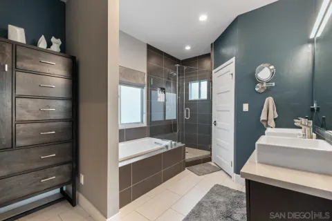 a bedroom with furniture and a flat screen tv