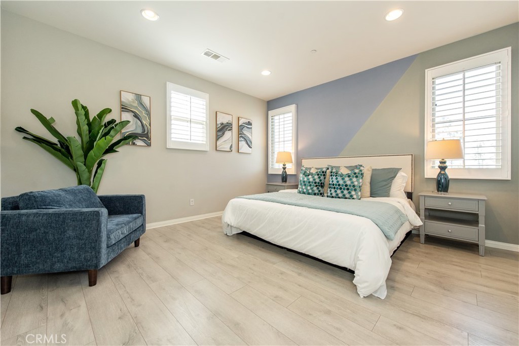 68 Origin Irvine, CA 92618 - Photo 29 of 43 a bedroom with bed and a potted plant