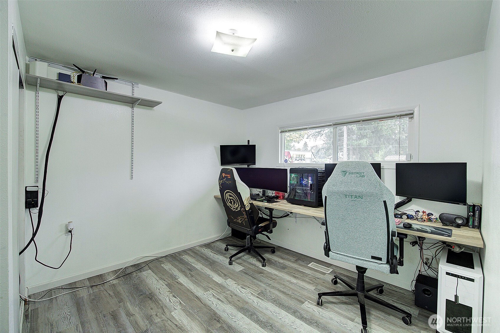 35814 11th Avenue Southwest Federal Way, WA 98023 - Photo 11 of 24 a view of a workspace with furniture and a window
